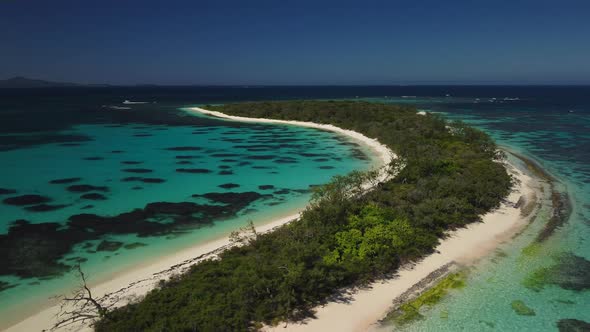 Wide aerial panoramic view of secluded, beautiful tropical island, New Caledonia.