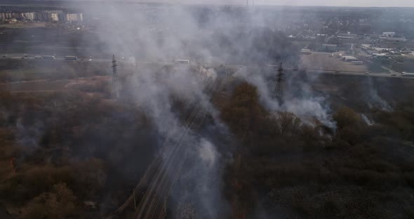 Large Scale Field Fire Near Railroad Traffic On Highway