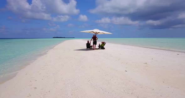 Romantic man and woman on romantic honeymoon enjoy luxury on beach on summer white sandy 4K backgrou
