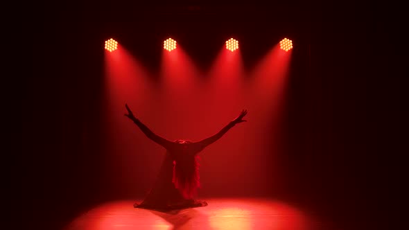 Young Elegant Female Dancer in Black Costume Performing Contemp Choreography in the Smoke of a Dance