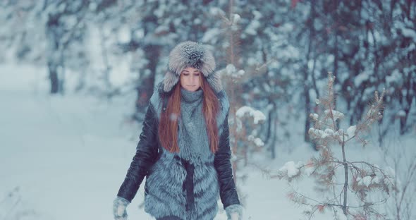 Beautiful Woman Walking in the Snow
