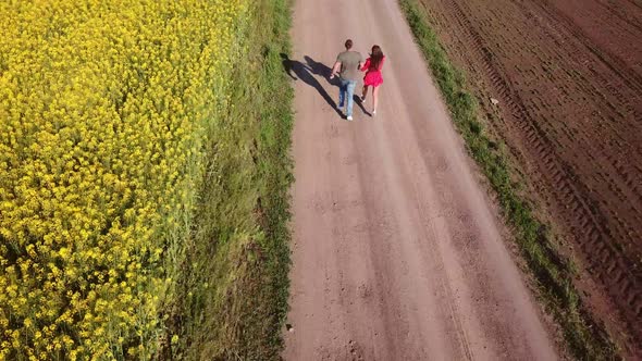 Couple Walking on a Dirt Road