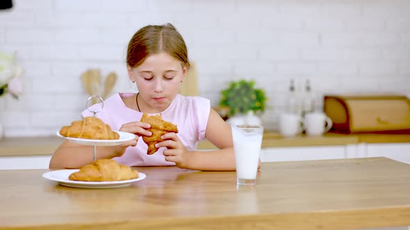 Girl Eating Croissant