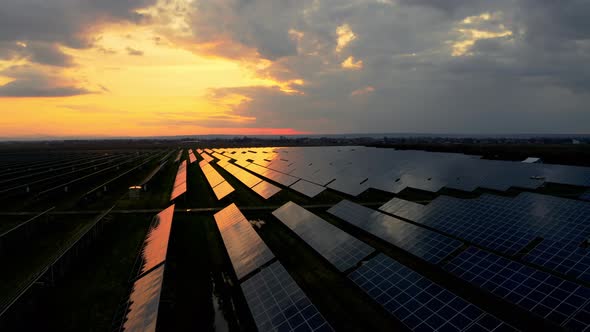 Aerial drone shot of Solar Power Station at Dusk. Top view of Solar Power station in Europe.