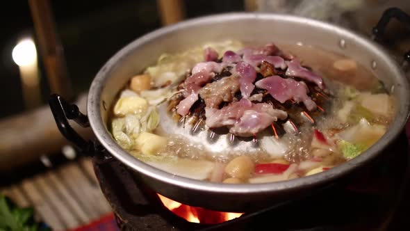 Thai barbeque style. Grilled meats and boiled vegetables on frying pan.