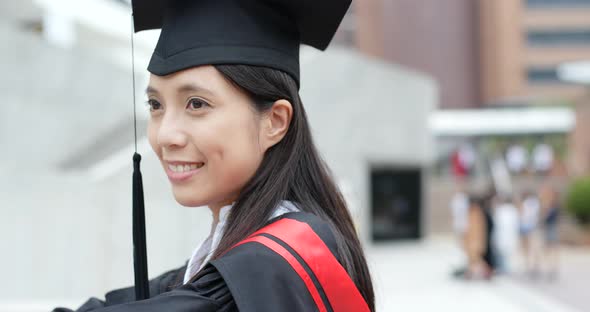 Cheerful asian woman get graduation 