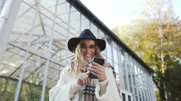 Young Woman in the Stylish Sunglasses Writing Some Thought 