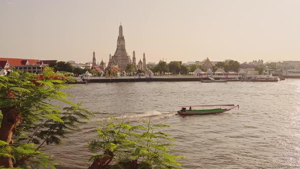 Thailand Bangkok Sunset River City Scene, Tourist Boat Trip Water Taxi and Buddhist Temple of Wat Ar