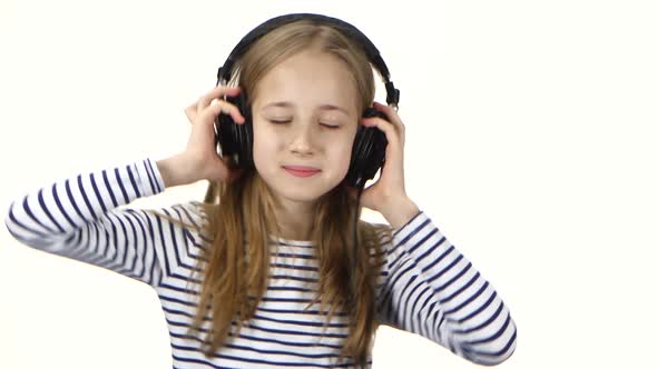 Teenager Girl Listens Music on Headphones and Dances, Close Ups