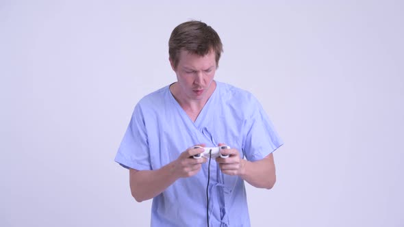 Stressed Young Man Patient Playing Games and Losing