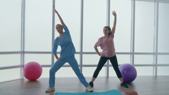 A Pregnant Woman Is Doing Physical Exercises For Pregnant Women