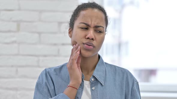 Young African Woman with Toothache Tooth Pain