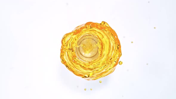 Super Slow Motion Shot of Oil Vortex Splash Liquid Isolated on White Background at 1000Fps