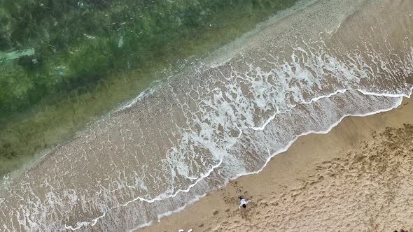 Kids playing on the beach aerial view