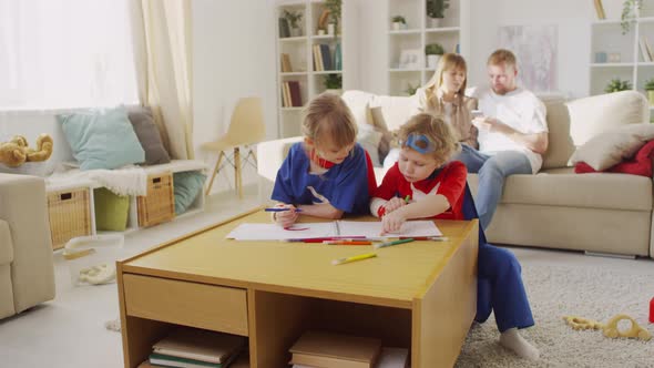 Children Drawing in Living Room