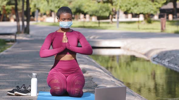 Black Instructor Holding Online Lessons Shows Breath Technique to Reach Inner Harmony Stress Relieve
