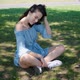 Portrait of Attractive Brunette Woman in Blue Dress Sitting in a Park - VideoHive Item for Sale