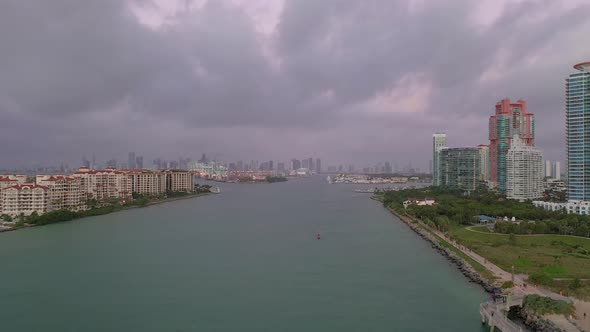 Time lapse video of Miami beach and overflight of the harbor entrance while a cruise ship is coming