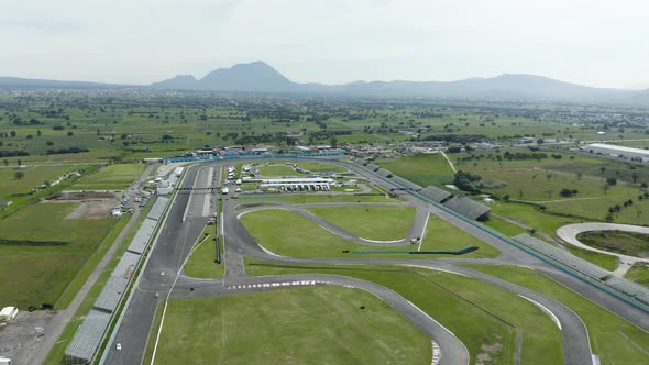 Aerial view cars speeding in racing circuit in Puebla, Mexico.