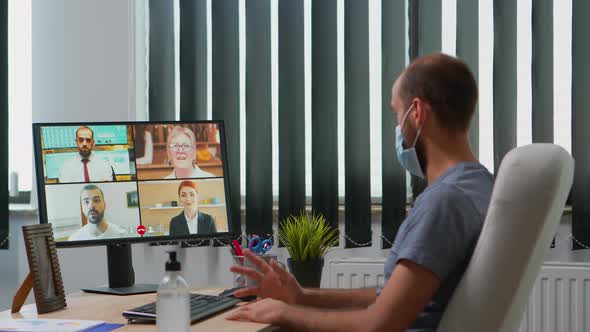 Business Man with Mask Talking on Video Call