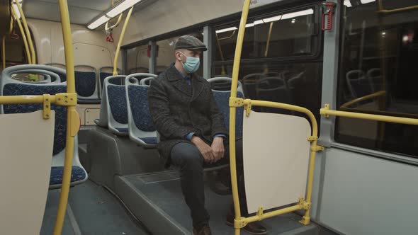 Young Man Wearing Face Mask Travelling in the Bus