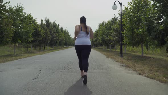 Fat Girl Runs Along the Road