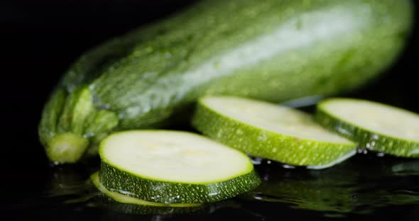 Round Slices of Zucchini Rolling in the Water. 