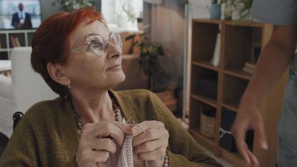 Senior Woman Knitting at Nursing Home