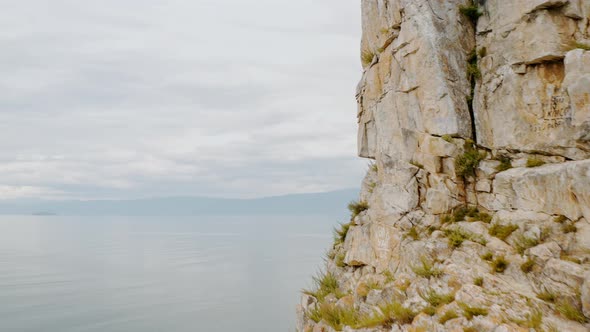 Beautiful lake behind the rock Summer Baikal lake Olkhon island