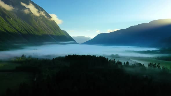 Morning Mist Over the Valley Among the Mountains in the Sunlight