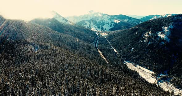 Cinematic Aerial View High Above Mountain Pass Highway Road