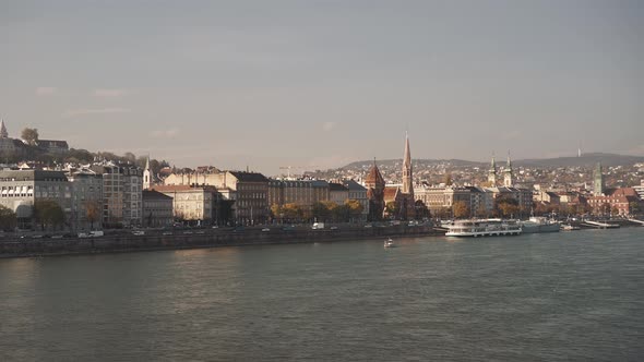Pan Shot Left To Right of Buda and River Danube in Winter Under Blue Grey Sky