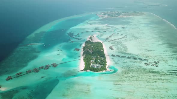 Aerial Drone View of a Beautiful Atoll or Island with a Resort in the Maldives