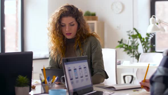 Ui Designers with Computers Working at Office 