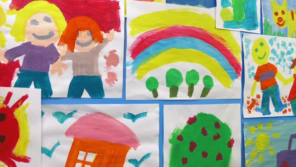 Passing Kid's Paintings On Wall alt