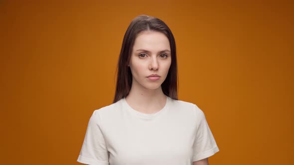 Young Bored Woman Making Blahblah Gesture with Hand Against Blue Background