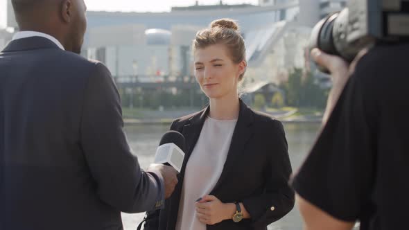 Woman Being Interviewed Outdoors