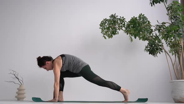 Yoga Studio and Instructor Conducts a Lesson