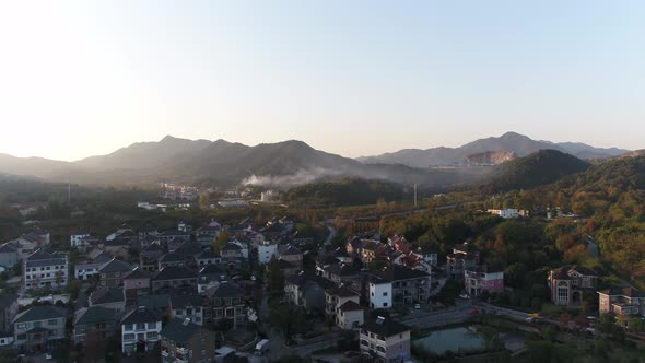 Mountain village and farmland in the sunset