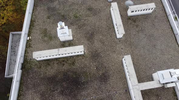 Aerial view of a drone flying over the residential buildings, roof shooting and architecture.