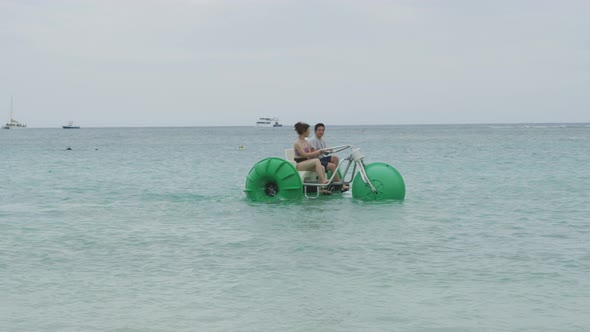 Couple on water tricycle in Hawaii