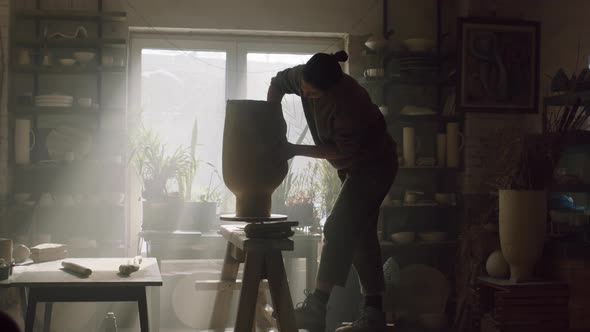 Woman Is Sculpting Vessel From Raw Clay