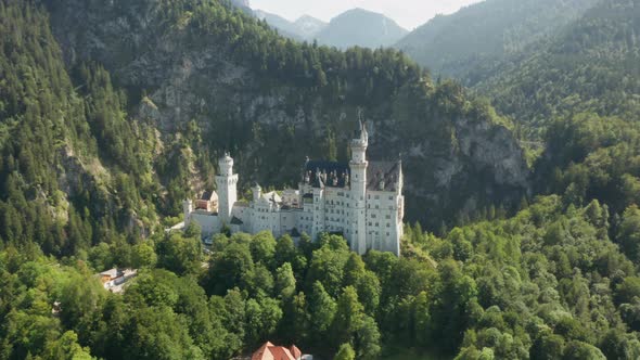 Panoramic View of Neuschwanstein Castle and Rocky Alps Mountains on the Background Bavaria Germany