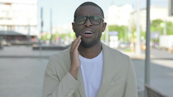 Portrait of African Man Having Toothache Outdoor