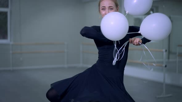 Charming Joyful Ballet Dancer Spinning with Balloons Releasing Toys Leaving