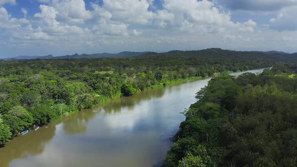 Aerial Drone View of Rainforest River and Mountains Scenery in Costa Rica at Boca Tapada, San Carlos