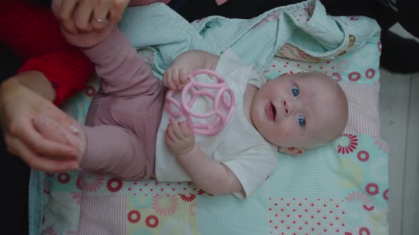 Baby Girl Lying On Play Mat