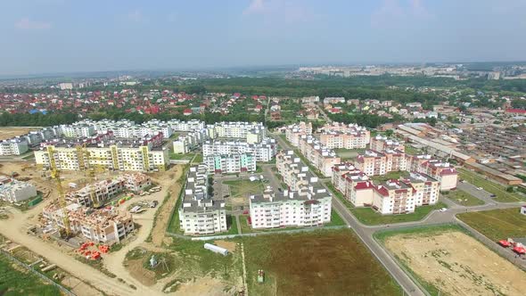 view of the city with the construction of a new modern district with high rise buildings.