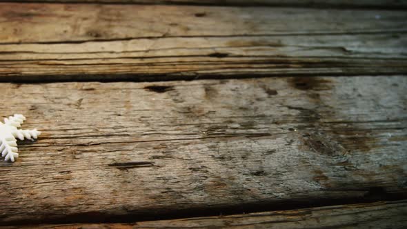 Star and snowflake on wooden plank