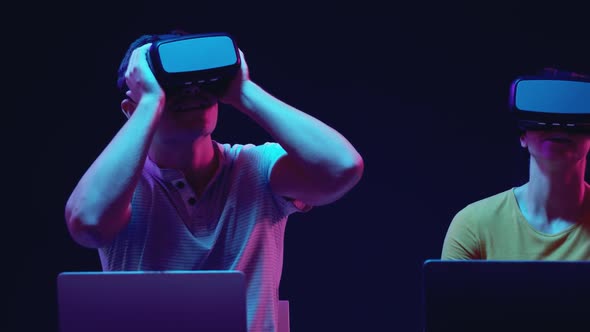 Man and woman wearing VR headsets